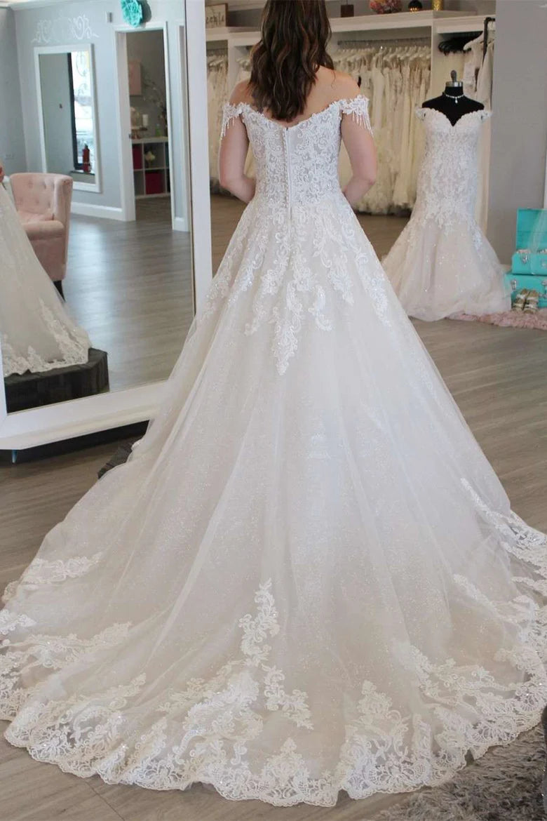 Robe de mariée longue trapèze à épaules dénudées et à pompons avec appliques